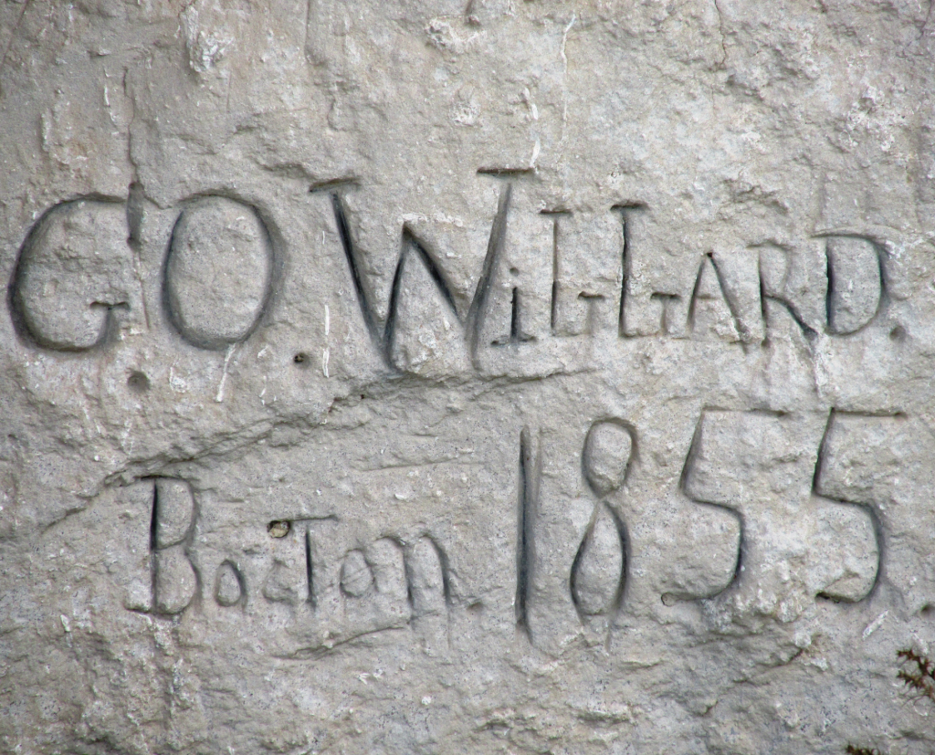Writing carved into rockside